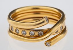 George Jensen a Magic ring combination of a gold band inset with brilliant cut diamonds and a