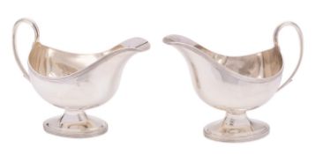 A pair of Edward VII silver gravy boats, maker Elkington & Co, Birmingham 1903, reeded rim,