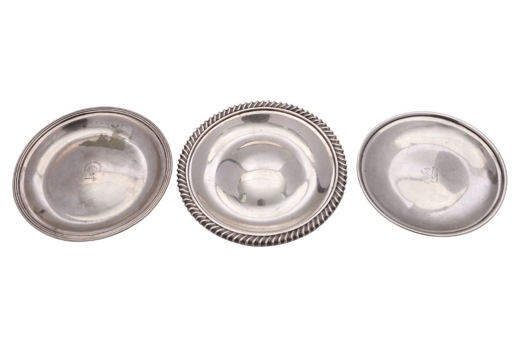 Three silver wine funnel stands, the larger with a gadrooned rim by James & Walter Marshall,