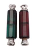 Two Victorian silver mounted facetted coloured glass double ended scent bottles, both unmarked,