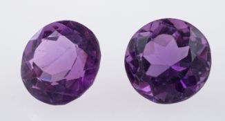 A Collection of loose stones, aquamarine, amethyst, largest stone approximately 22 carats,