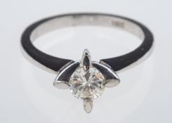 A contemporary diamond solitaire engagement ring, the brilliant cut diamond of 0.