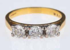 Three stone diamond ring, brilliant cut stones with a total carat weight of 1.