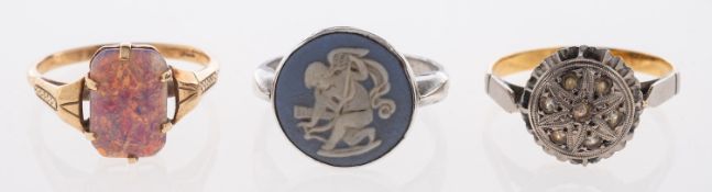 Three rings, to include: a Wedgwood cameo ring, the circular cameo depicting Cupid,