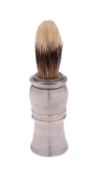 A silver handled shaving brush by British Metallising Co. Ltd, London 1935, linear engraved, 12.