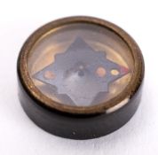 A WWII button compass.