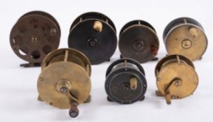 Five brass fishing reels and two brass and alloy reels,