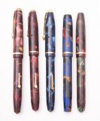 A group of four Conway Stewart Dinkies 550's and a Dinkie 540 fountain pens.