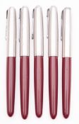A group of five Parker 51 fountain pens, maroon barrel with sliver plated caps.