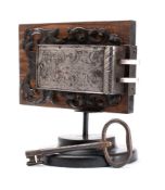 A 17th century French steel engraved rim lock with key,