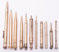 A group of eleven various gold plated and gilt propelling pencils, various makers including Parker,