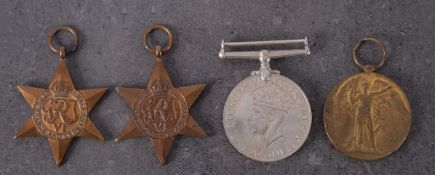 A WWI Victory Medal to DM2-189988 Pte J W Foulston ASC' together with a WWII group of three in