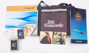 A small collection of British Airways and Air France Concorde memorabilia, including a menu,