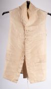 Three gentleman's silk and cotton ivory waistcoats, a brown silk metal-threaded waistcoat,