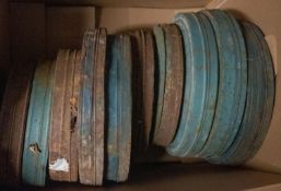 A collection of approximately 80 35mm film canisters containing various films,
