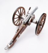 A 20th century 1/10th scale model of a Napoleonic 12 pound cannon.