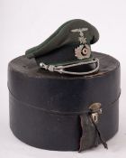 A WWII German Mountain Infantry Officers peaked cap, green cloth with dark green piping,