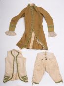 An 18th-century three-piece gentleman's suit comprising a tailcoat with long sleeves with later
