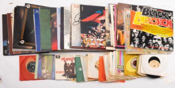 A collection of approximately 35 vinyl LPs and 30 7