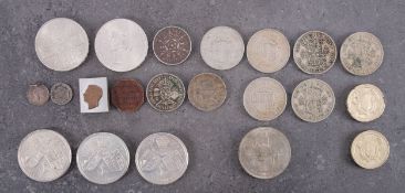 A quantity of GB and world coins and notes, including commemorative crowns.