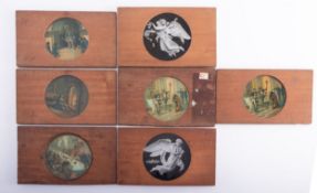 A group of seven mahogany framed transfer printed Magic Lantern slides, unsigned,