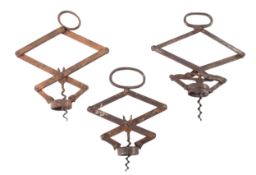 A marked Heeley's patent 'THE PULLEZI' concertina corkscrew in a copper finish steel;
