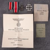 Two WWII Iron Crosses , Second Class, both with related ephemera.