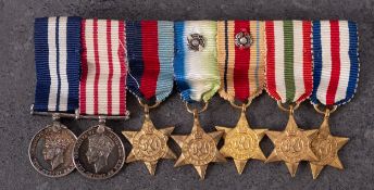 A WWII DSM miniature group of seven , DSM, Naval General Service Medal, 1939-45 Star,