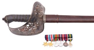 An Edward VII Officer dress sword the straight single edge fullered blade with acid etched