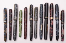 A collection of twelve Burnham fountain pens, including a blue marbled no61, red-grey no.