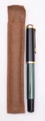 A Pelikan 400 piston fill fountain pen in green and black stripes having Pelikan 14ct gold nib-