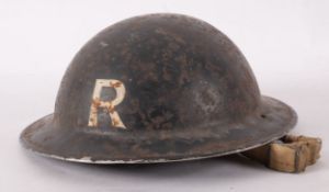 A WWII Mk I steel helmet 'Rescue', with chin strap.