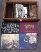 A collection of coins and notes including 1970 and 1971 proof sets, £5 & £2 coins,