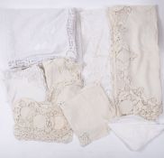 A collection of Chinese embroidered dinner service items including a large tablecloth with eight