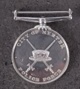A silver City of Exeter Police Force Long Service and Efficiency Medal, maker T & J Bragg Ltd,