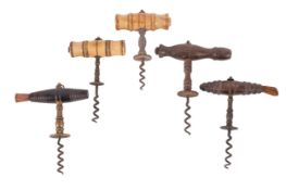 Five T-handle corkscrews with flat serrated buttons, two turned bone and three wood handle examples,