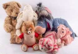A collection of soft toys to include a large teddy bear,