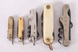 Five miniature folding pocket knives with corkscrews,