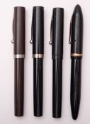 A group of four Sheaffer fountain pens.