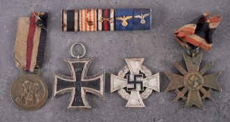 A WWI Iron Cross, second class, together with a WWII German/Italian North Africa Medal,