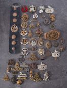 A collection of various cap and lapel badges etc, Royal Horse Guards, Royal Artillery and others.
