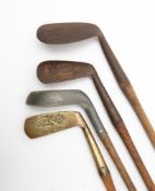 A group of four hickory shaft golf clubs, comprising a Percy Baxter Nilblick,