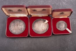 Three cased Spink & Son medallions,