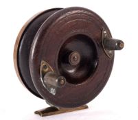 An unusual Nottingham all brass back and spine fishing reel on a short foot, twin composite handles,