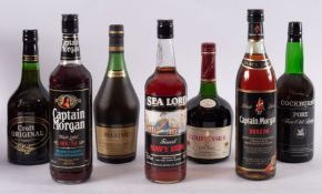 A bottle of Courvoisier Luxe Cognac, a bottle of Napoleon Maxime Brandy,