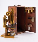 A lacquered brass microscope, maker R & J Beck,Ltd, London, serial number 26022,