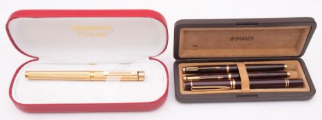 A Sheaffer Prelude gold plated fountain pen in red leather cased,