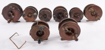 A large Nottingham 5 1/2 inch stamped mahogany and brass star back fishing reel,