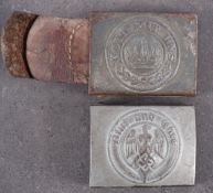 A German Army belt buckle and a Hitler Youth belt buckle.