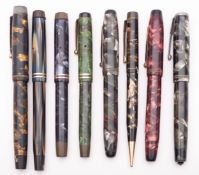 A group of seven various marbled Parker fountain pens, including 'Victory' and 'Duofold',